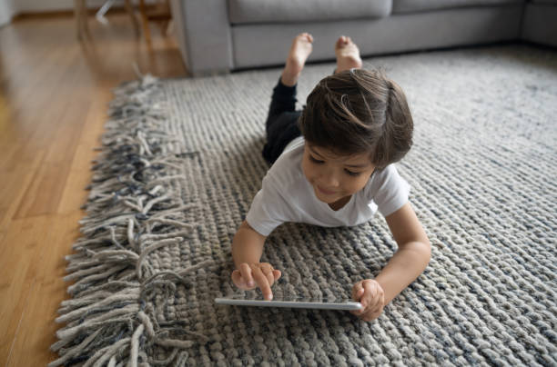 Girl lying on area rug | A & S Carpet Collection