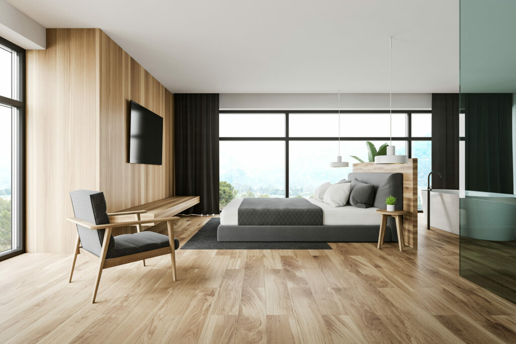 Laminate floors in a spacious bedroom by A&S Carpet Collection in Allison Park, PA.