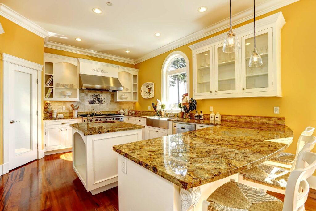Hardware floors in a large kitchen with two islands by A&S Carpet Collection